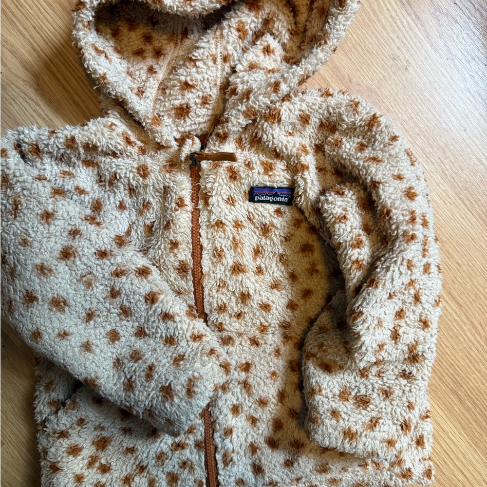 Patagonia Cream Sherpa Hoodie with giraffe spots.